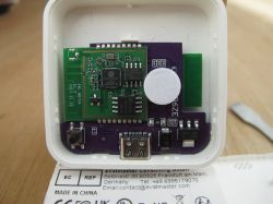 Electronic circuit board with visible USB port and components on a PCB.