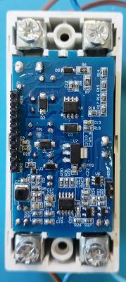 Inside of Aliexpress Device - PCB View Close-up of a printed circuit board with various electronic components inside a device.