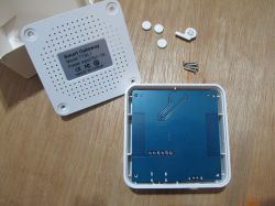 Tuya TYBL1 Smart Gateway with Open Case Opened case of Tuya TYBL1 Smart Gateway showing internal components and screws.
