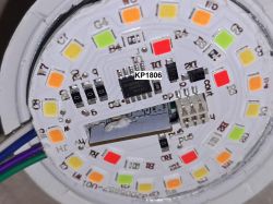 Close-up of the interior of a smart LED bulb showing electronic components.