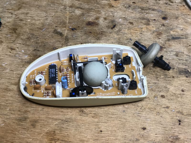 Disassembly of an Old Ball Mouse Interior Interior of a disassembled ball mouse with old mechanism