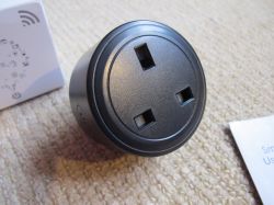 Tuya BSD29 UK 20A Smart Plug for Energy Monitoring Black Tuya BSD29 UK 20A smart plug with instructions on carpet.