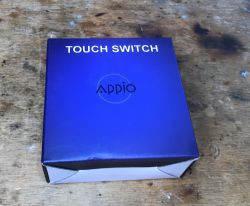 Appio 9620 Box Box of Appio 9620 touch controller on wooden background