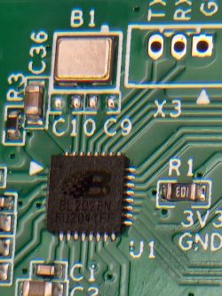 Circuit Board with BL2023N Chip Close-up of a circuit board with a BL2023N chip and surrounding electronic components.