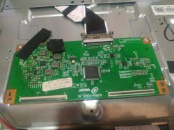 Image of a green electronic circuit board with various components and connections.