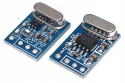 Dwa moduły RF 433 MHz na niebieskich płytkach PCB z widocznymi komponentami.