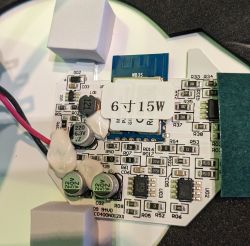 Close-up of a circuit board with electronic components and a 6V 15W label.
