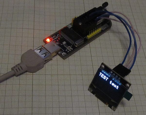 CH341 Module with OLED Display CH341 module with OLED display showing text.