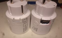Two Deltaco smartplugs, one with a cut-out revealing internal circuit board