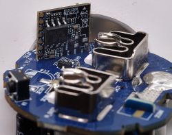 Close-up view of the smart plug communication board with chip W701.
