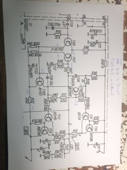 Schemat elektryczny na kartce papieru z notatkami i oznaczeniami.