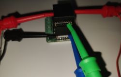 Close-up of a 1-channel Gerier WiFi switch with connected test leads.