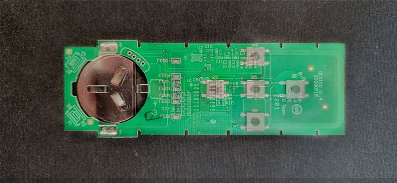 Inside View of Remote Control Circuit Board Photo of remote control interior showing circuit board and battery slot.