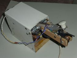 DIY Spot Welder with Makeshift Construction DIY spot welder with a makeshift construction, consisting of a metal and wooden casing.