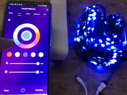 Controlling LED lights via smartphone app Smartphone app and blue glowing LED lights
