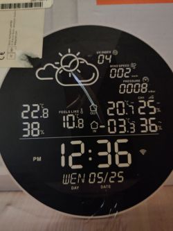 Tuya Setti SMS603 weather station screen displaying weather data and time.
