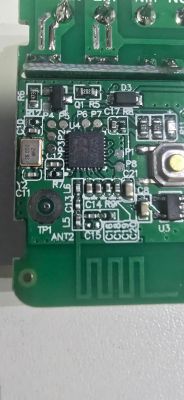 Close-up of PCB with BK7231N chip and labeled UART pinout
