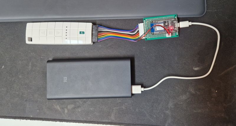 RF Remote with WiFi Connected to Prototype Board Remote control with a connected WiFi board via colorful wires.