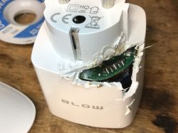 Damaged Electrical Socket with Exposed Circuit Board Damaged electrical socket with an exposed PCB.