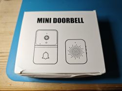 White box with illustrations and the label “MINI DOORBELL” on top.