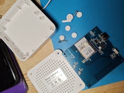 Open enclosures and components of a Smart Gateway with a PCB.