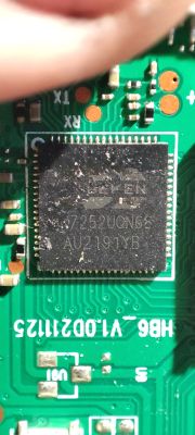 Close-up of a BK7252UQN68 integrated circuit on a green printed circuit board with electronic components and traces.