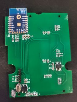 Circuit Board with Module Photo of a circuit board with a blue module attached.