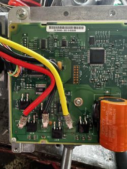Steering booster control board with connected power wires and electronic components