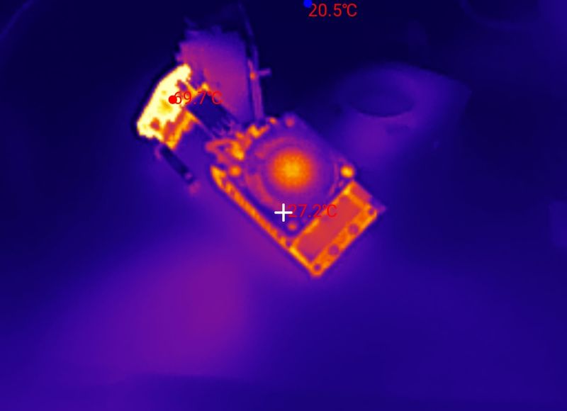 Thermal image of an electronic PCB with a hot spot around 69.7°C and background around 20.5°C