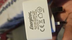 Close-up of an Energizer plug and adapter showing technical specifications.