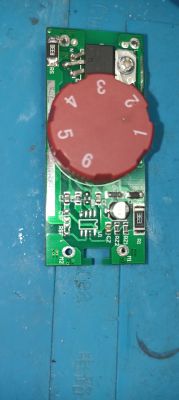 Circuit board with red dial and missing 8-pin IC PCB with red dial and empty footprint for 8-pin integrated circuit