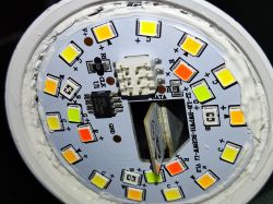 Close-up of a Miboxer FUT103 LED bulb with technical specifications visible on the casing.