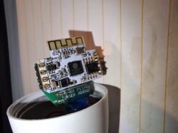 ESP8266 Module in Smart Bulb ESP8266 module on a circuit board inside a smart bulb.