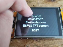 ESP32 TFT Touchscreen Display Interaction Finger touching a touchscreen display with ESP32 TFT.
