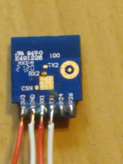 Electronic module with pin labels and connected wires.