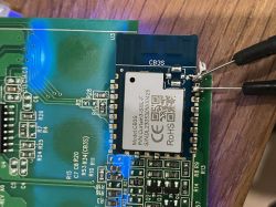 CB3S module on PCB with attached test probes and visible SMD components