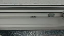 How do I open the roller shutter revision?
