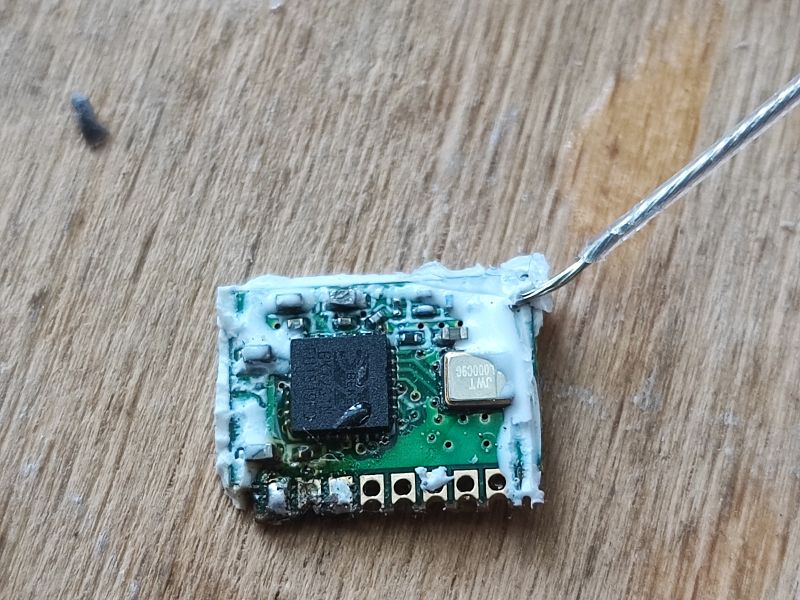 WiFi Module on Wooden Surface WiFi module on a wooden surface.