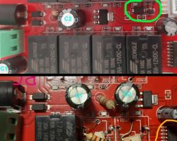 Close-up of two printed circuit boards with electronic components, including capacitors, relays, and resistors.