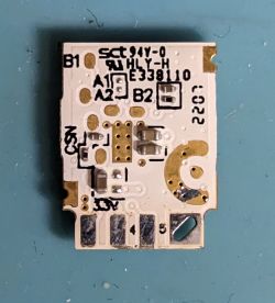 LED Bulb Lepro GU10 RGBWW Circuit Board Close-up view of the LED bulb's printed circuit board with markings and electronic components.
