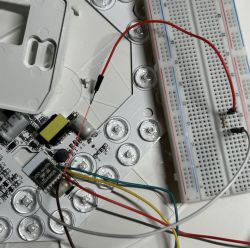 Breadboard and Electronic Circuit Breadboard with connected wires on top of an electronic circuit.