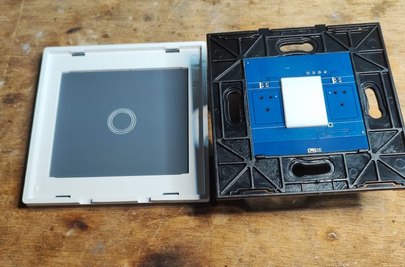 Interior of the QTouch Switch Panel Disassembled QTouch touch switch panel showing the circuit board and housing.