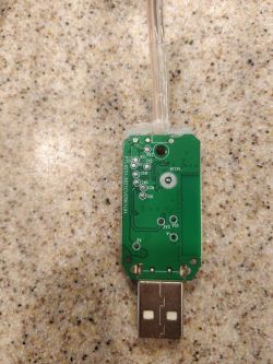 PCB Board of LED Light Controller with USB Connection Close-up of a PCB board with visible pins and USB connection.