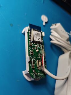 PCB with electronic components on a blue background.