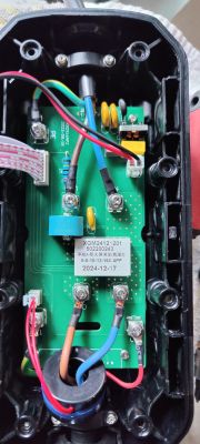 Interior view of enclosure with PCB and connected power wires.