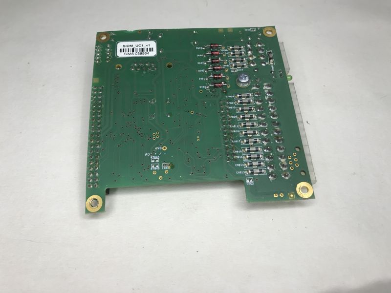 Bottom view of PCB labeled SIOM_UC1_v1 with SMD components and barcode sticker.