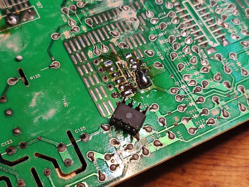 PCB with Integrated Circuit Close-up of a circuit board with a soldered integrated circuit.