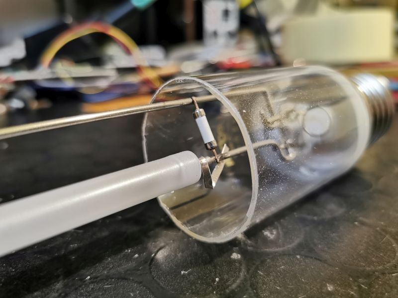 Close-up of a cut glass bulb showing internal parts of an electronic tube