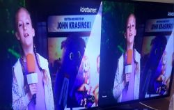 Double Image on Television Double image on TV screen showing a girl holding a microphone.