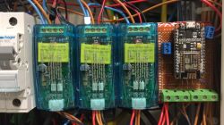 Prototype Control System with ESP8266 and Relay Modules Relay modules and ESP8266 on a prototype board in an electrical distribution box.